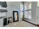 Open entryway with high ceilings, large windows, and modern decor and shelving at 1013 Corsica Ln, Las Vegas, NV 89144