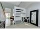 Open entryway with high ceilings, modern shelving, and a view into the living area at 1013 Corsica Ln, Las Vegas, NV 89144