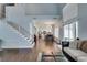 Bright open-concept space with a staircase and a sliding glass door to the backyard at 1013 Corsica Ln, Las Vegas, NV 89144