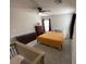 Cozy bedroom with natural light, soft carpet and minimalist furnishings at 10331 Ednor St, Las Vegas, NV 89183