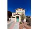 Two-story home with a well-manicured front yard and a bright blue front door at 10331 Ednor St, Las Vegas, NV 89183
