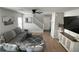 Spacious living room featuring modern decor, grey couches and plenty of natural light at 10331 Ednor St, Las Vegas, NV 89183
