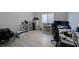 Functional bedroom with a window for natural light, and laminated floors at 10668 Berkshire Woods Ave, Las Vegas, NV 89166