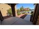 Inviting covered front porch featuring a landscaped yard and view of neighborhood street at 10668 Berkshire Woods Ave, Las Vegas, NV 89166