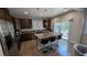 Kitchen with granite countertops, stainless steel appliances, and an island with barstool seating at 10668 Berkshire Woods Ave, Las Vegas, NV 89166