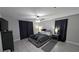 Spacious main bedroom suite features ceiling fan, curtains, and a modern design at 10668 Berkshire Woods Ave, Las Vegas, NV 89166