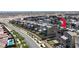 Expansive aerial view of modern home featuring rooftop deck, patios, and a pristine community pool at 11658 Midnight Melody Ave, Las Vegas, NV 89138