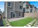 A newly landscaped backyard with artificial turf provides the perfect space for entertaining at 11658 Midnight Melody Ave, Las Vegas, NV 89138