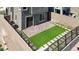 Backyard featuring artificial turf, paver patio and stepping stones with surrounding fencing and proximity to home at 11658 Midnight Melody Ave, Las Vegas, NV 89138