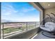 Relax on this covered balcony with comfortable swing chair and take in the city and mountain views at 11658 Midnight Melody Ave, Las Vegas, NV 89138