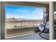 Relax on this covered balcony with comfortable swing chair and take in the city and mountain views at 11658 Midnight Melody Ave, Las Vegas, NV 89138