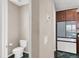 Bathroom and kitchenette featuring modern fixtures, granite countertops, and dark wood cabinets at 11658 Midnight Melody Ave, Las Vegas, NV 89138
