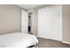 A bedroom with a closet and white door at 11658 Midnight Melody Ave, Las Vegas, NV 89138