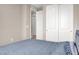 A bedroom with closet and a blue bed at 11658 Midnight Melody Ave, Las Vegas, NV 89138