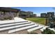 Inviting common area with tiered steps, a grassy lawn, and landscaping for community enjoyment at 11658 Midnight Melody Ave, Las Vegas, NV 89138