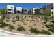 Community landscaping with gravel, desert plants, and multi-story homes at 11658 Midnight Melody Ave, Las Vegas, NV 89138