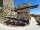 Charming entrance to Blacktail community featuring stone accents, modern signage, and manicured landscaping at 11658 Midnight Melody Ave, Las Vegas, NV 89138