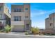 Modern two-story home with clean lines, large windows, neutral color palette, and manicured landscaping at 11658 Midnight Melody Ave, Las Vegas, NV 89138