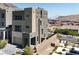 Modern multi-story home showcasing contemporary design, a two-car garage, and professional landscaping at 11658 Midnight Melody Ave, Las Vegas, NV 89138