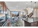 Bright kitchen and dining area with modern lighting, sleek countertops, stainless steel appliances, and scenic views at 11658 Midnight Melody Ave, Las Vegas, NV 89138
