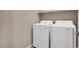 Convenient laundry room with a side-by-side washer and dryer, ready for easy laundry days at 11658 Midnight Melody Ave, Las Vegas, NV 89138