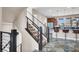 Staircase with view of kitchen and island seating at 11658 Midnight Melody Ave, Las Vegas, NV 89138