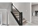 Carpeted staircase with stylish metal railings, connecting to upper level with a glimpse of an office space at 11658 Midnight Melody Ave, Las Vegas, NV 89138