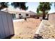 Spacious backyard with desert landscape and outdoor fire pit at 1709 High Breeze Ct, Las Vegas, NV 89106