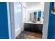 Bathroom with dual vanity, large mirror, tub, and shower at 1709 High Breeze Ct, Las Vegas, NV 89106