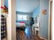 Bright bedroom with modern decor, wood floors, and a large window for natural light at 1709 High Breeze Ct, Las Vegas, NV 89106