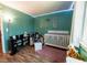 Green Bedroom bedroom with window, crib, and soft textures at 1709 High Breeze Ct, Las Vegas, NV 89106