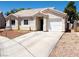 Charming single story home featuring a tile roof, two car garage and well manicured landscaping at 1709 High Breeze Ct, Las Vegas, NV 89106