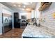 Updated kitchen features stainless steel appliances, granite countertops, and stylish white subway tile backsplash at 1709 High Breeze Ct, Las Vegas, NV 89106