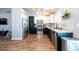 Eat-in kitchen featuring stainless appliances, granite countertops and white cabinetry at 1709 High Breeze Ct, Las Vegas, NV 89106
