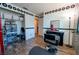 Salon-inspired living space featuring wood floors, salon chair, and fun retro-style decor at 1709 High Breeze Ct, Las Vegas, NV 89106