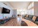 Open living room with hard surface flooring and an open concept to the kitchen at 1709 High Breeze Ct, Las Vegas, NV 89106