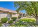 The backyard features lush landscaping, mature trees, and a well-maintained lawn, creating a serene outdoor space at 2085 Joy View Ln, Henderson, NV 89012