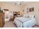 Bedroom with a work station, ceiling fan, and view of the ensuite bathroom at 2085 Joy View Ln, Henderson, NV 89012