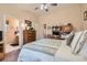 Bedroom with a work station, ceiling fan, and view of the ensuite bathroom at 2085 Joy View Ln, Henderson, NV 89012