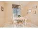 Cozy dining area with a white table and chairs, a pendant light fixture, and neutral wall color at 2085 Joy View Ln, Henderson, NV 89012