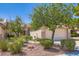 Charming home with lush landscaping, mature trees, and a well-maintained front yard, showcasing curb appeal at 2085 Joy View Ln, Henderson, NV 89012