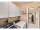 The laundry room features modern appliances and ample storage, making laundry days a breeze at 2085 Joy View Ln, Henderson, NV 89012