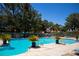 Inviting community pool and tanning area with palm trees providing a relaxing oasis at 2851 S Valley View Blvd # 1130, Las Vegas, NV 89102