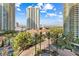 Amazing aerial view of the community's entrance, resort-style pool, and the towering buildings in the background at 2877 Paradise Rd # 702, Las Vegas, NV 89109