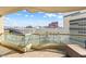Balcony featuring tiled flooring and a glass barrier, with a skyline view of the city at 2877 Paradise Rd # 702, Las Vegas, NV 89109