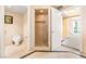 Neutral bathroom with a glass shower, toilet and vanity at 2877 Paradise Rd # 702, Las Vegas, NV 89109