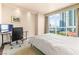 Cozy bedroom with floor to ceiling windows and an open workspace at 2877 Paradise Rd # 702, Las Vegas, NV 89109