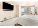 Bedroom featuring a city view, large windows and modern finishes for comfortable living at 2877 Paradise Rd # 702, Las Vegas, NV 89109