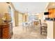 Dining room with a modern chandelier, sleek furniture, and access to a balcony at 2877 Paradise Rd # 702, Las Vegas, NV 89109