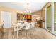 Open dining room with a view of the kitchen and a balcony; ample natural light at 2877 Paradise Rd # 702, Las Vegas, NV 89109